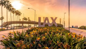 A landscape view of LAX airport entrance with large 